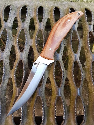 Convex ground trailing point hunter in 14C28N and Permali densified wood.